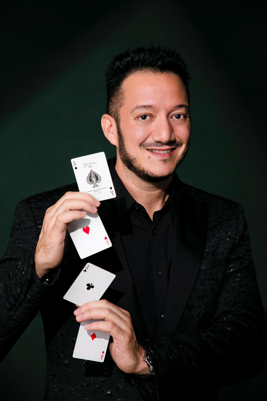 Jose holding a magic award