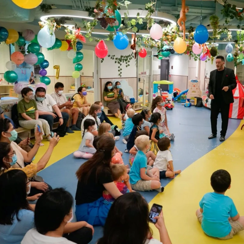 Group of children at a birthday party magic show