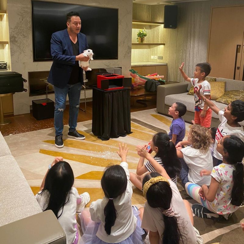 Birthday party magic show with happy children