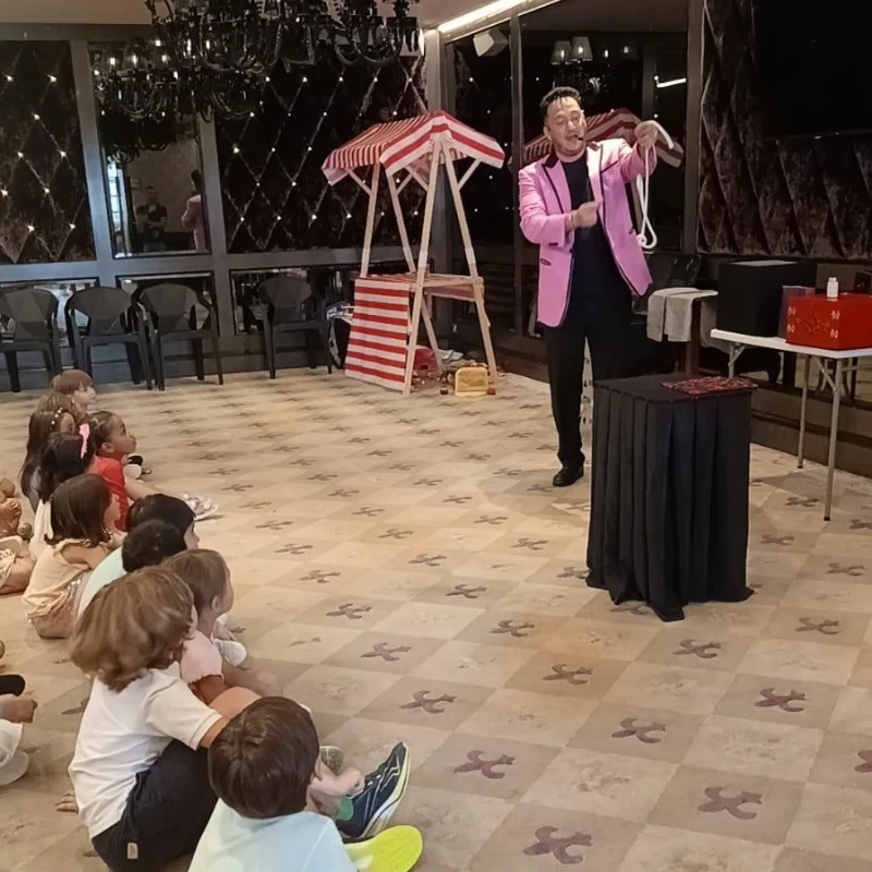 Birthday star participating in the magic show